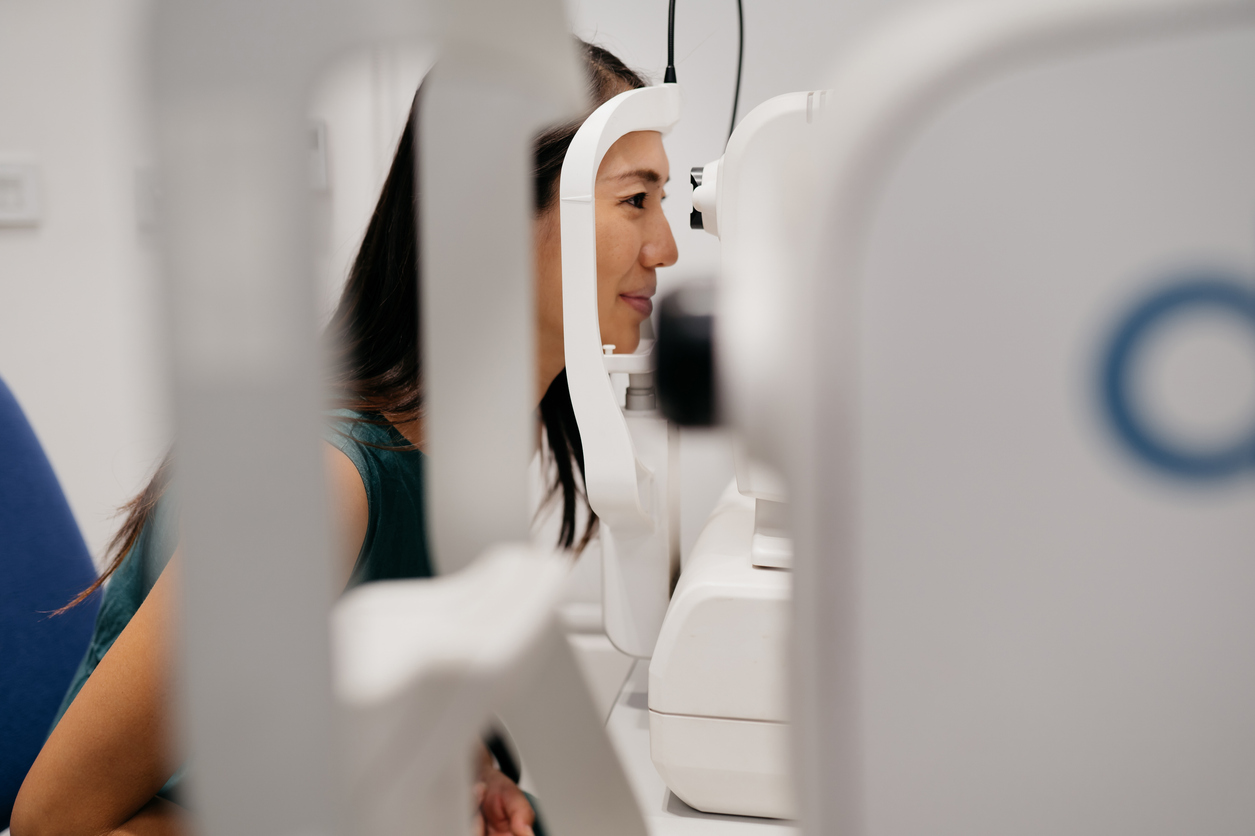 Young beautiful Asian woman having an eye exam